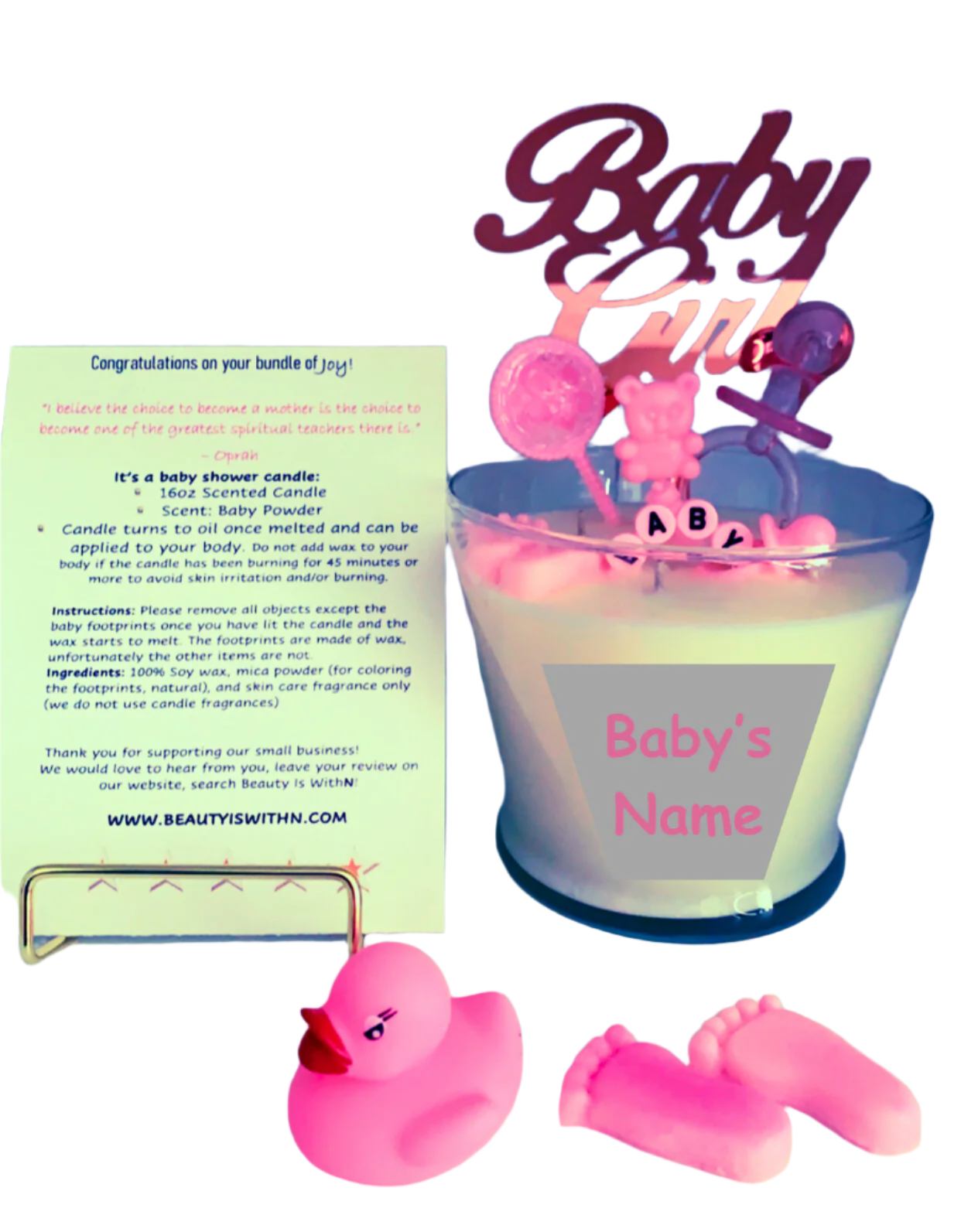 Pink 16oz baby shower candle with 'Baby Girl' topper, wax baby feet, rubber duck, and baby-themed decorations (decorations may vary on availability). Includes an instruction card and customizable label for baby's name. Scent: Baby Powder