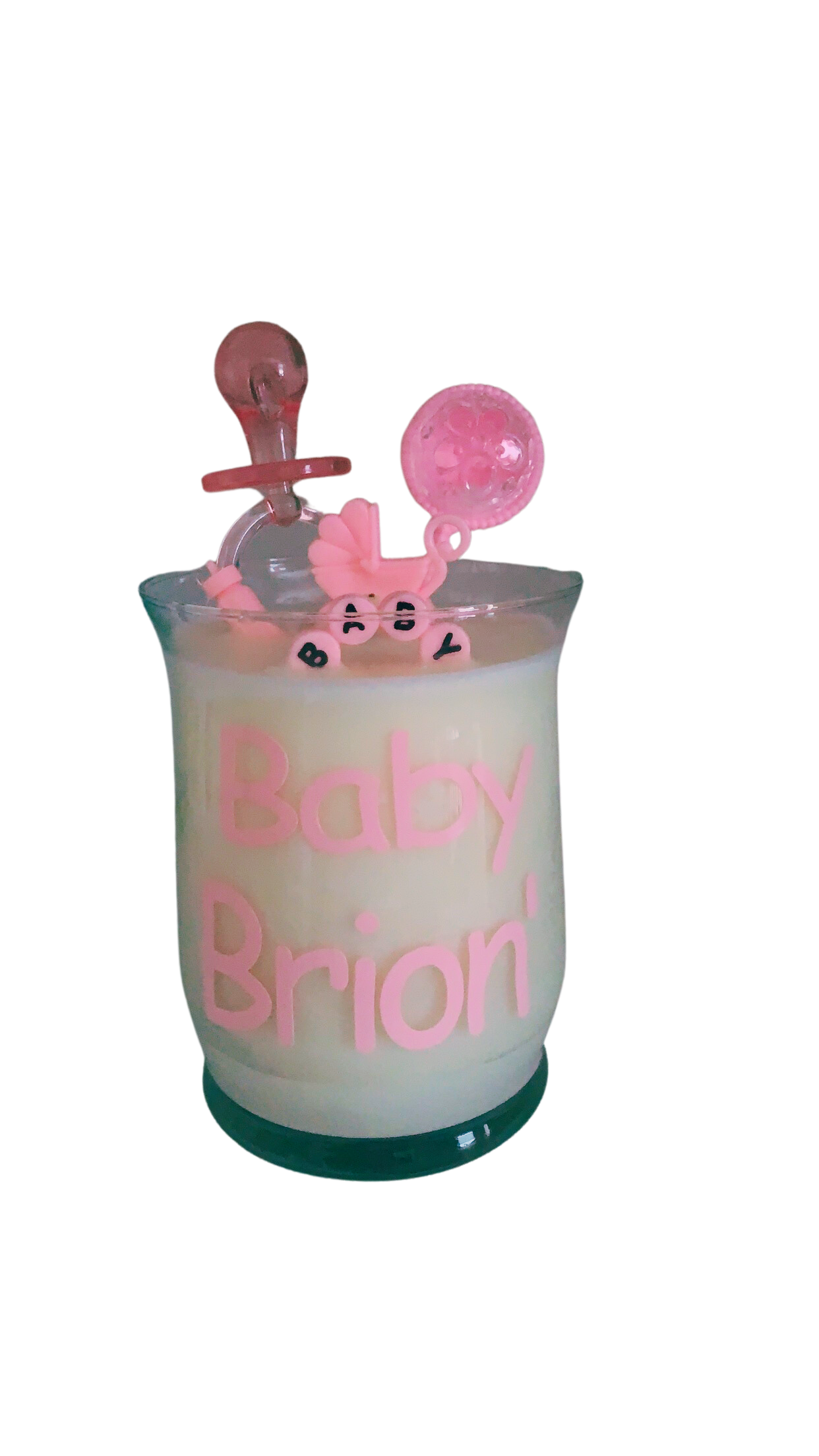 Pink 10oz baby shower candle with 'Baby Girl' topper, wax baby feet, rubber duck, and baby-themed decorations (decorations may vary on availability). Includes an instruction card and customizable label for baby's name. Scent: Baby Powder