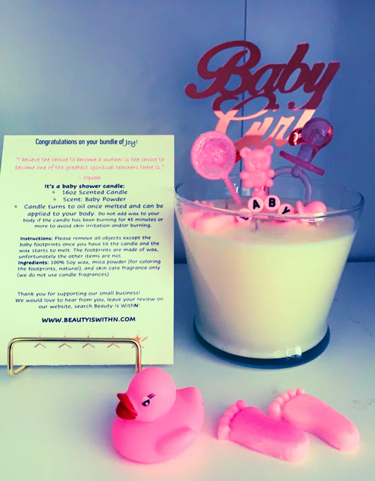 Pink 16oz baby shower candle with 'Baby Girl' topper, wax baby feet, rubber duck, and baby-themed decorations (decorations may vary on availability). Includes an instruction card and customizable label for baby's name. Scent: Baby Powder